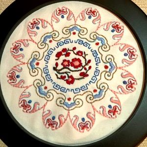 Hand embroidered flower mandala decoration.